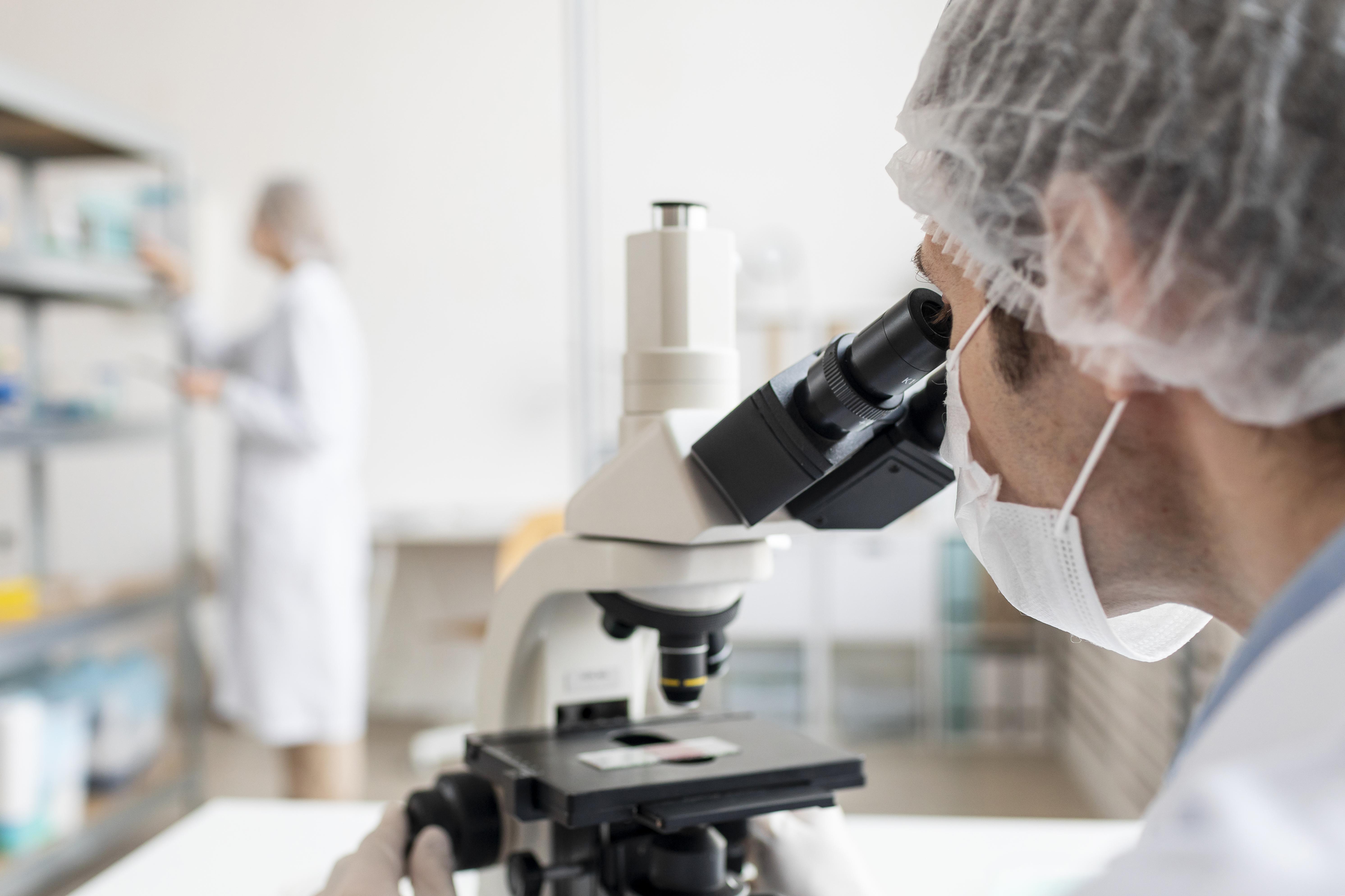 close-up-researcher-working-with-microscope